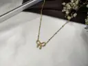 Prats Dainty Ribbon Pendant
